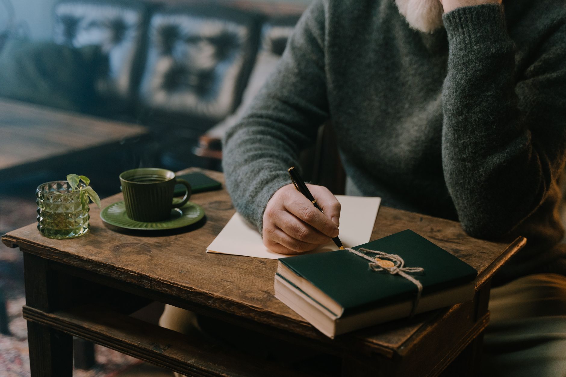 Traveler looking through journal in rustic cafe