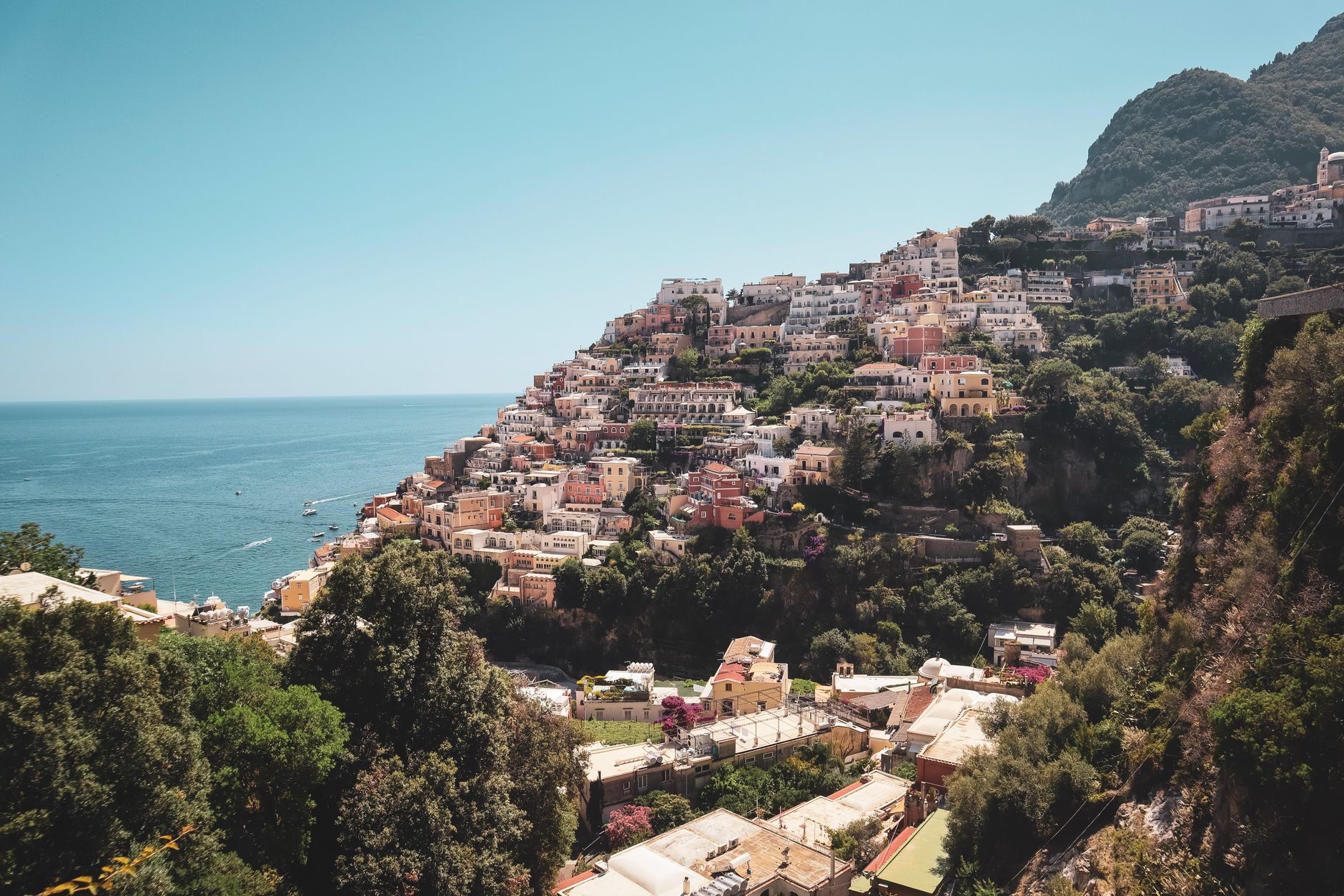 Sunlit terraced cliffside village along Amalfi Coast Italy